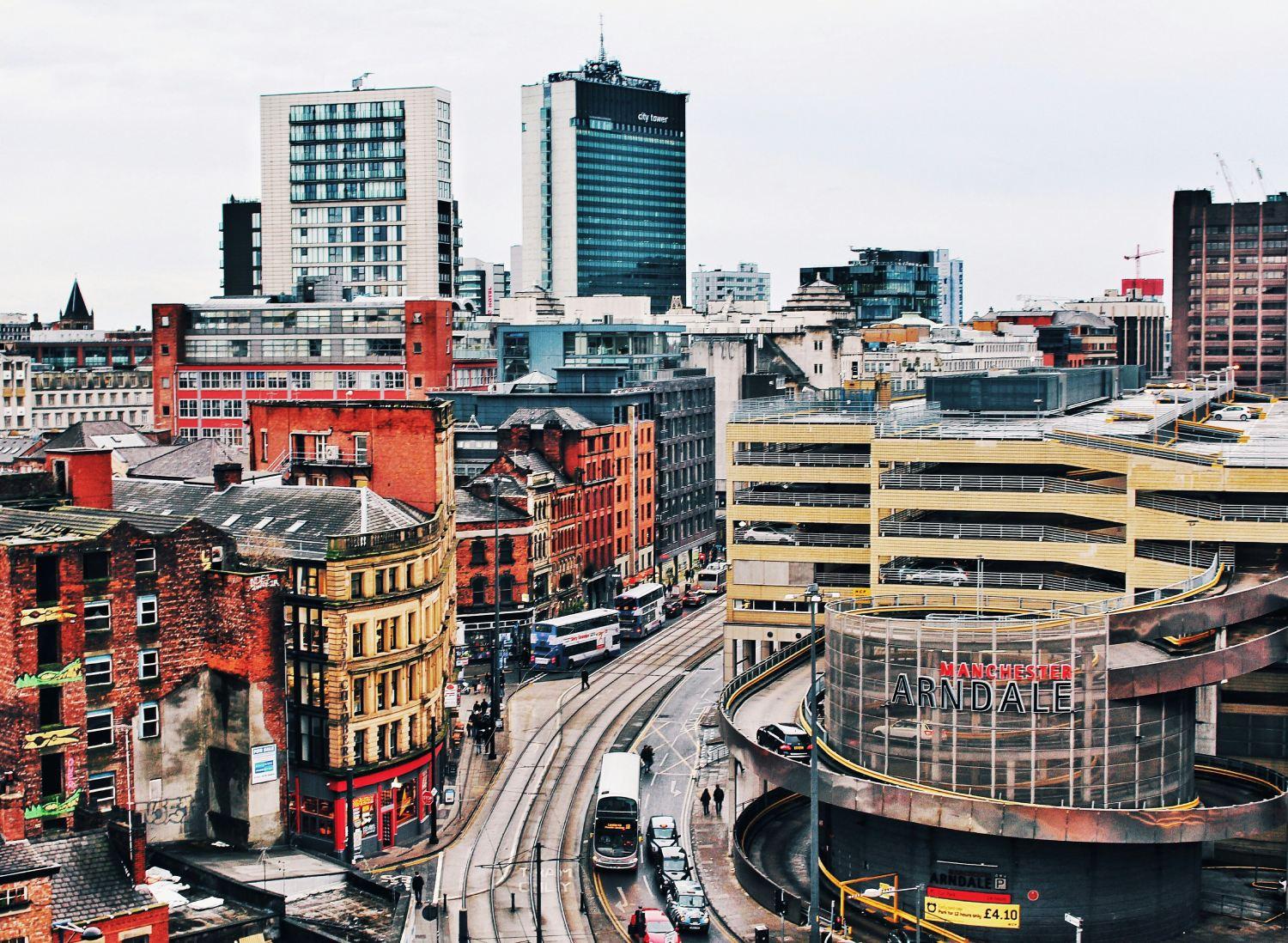 Manchester city center showing modern architecture and trams